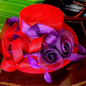 Sinamay hat in red and purple. Perfect for Opening Day!